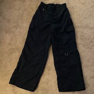 100 percent nylon pants had a strap on back top of pants was cut off